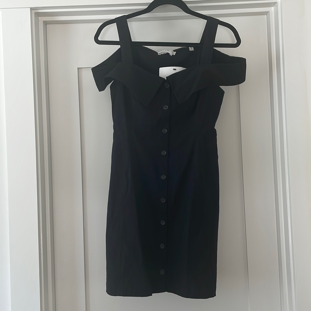 ALC black size 6 mini dress with cute straps. It was never worn, but no tags.
